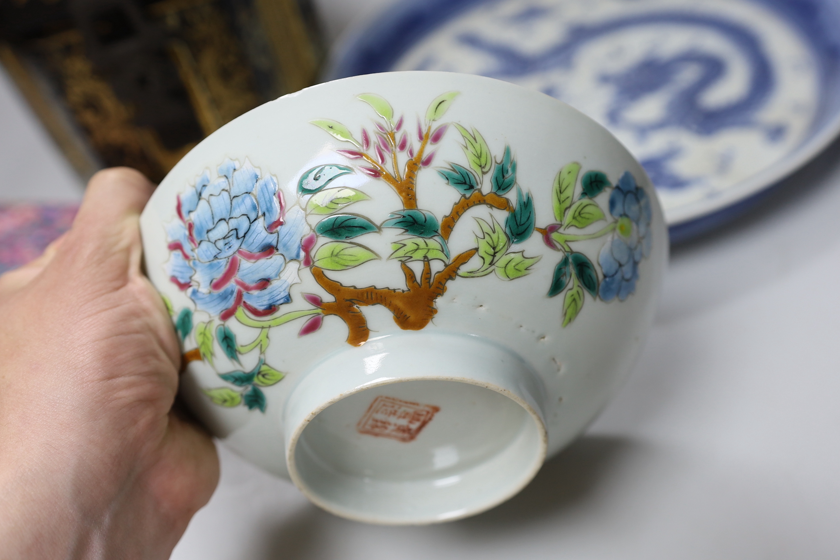 A Chinese blue and white dish, a famille rose bowl, a Canton enamel box and cover and a gilt decorated lacquer box and cover